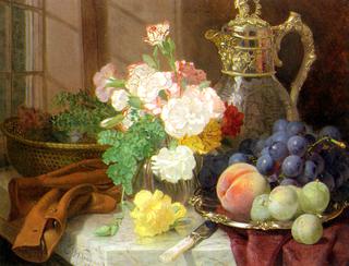 Carnations in a glass vase on a draped marble ledge