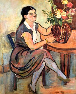 Woman Seated by a Bouquet of Flowers