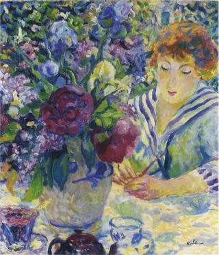 Woman with a vase of flowers