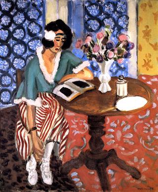 Woman Reading at a Small Table