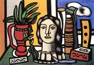 A Statuette and a Red Vase