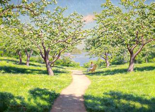 Woman on the bench in the spring garden