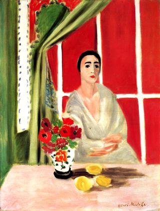 Seated Woman with a Red Screen in the Background