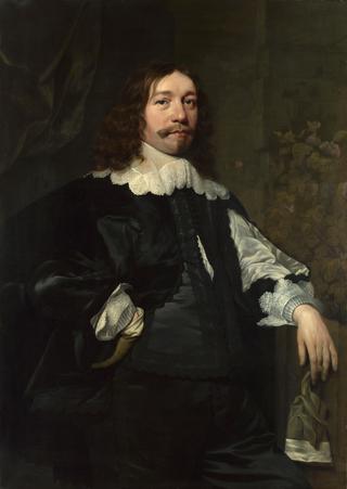 Portrait of a Man in Black holding a Glove