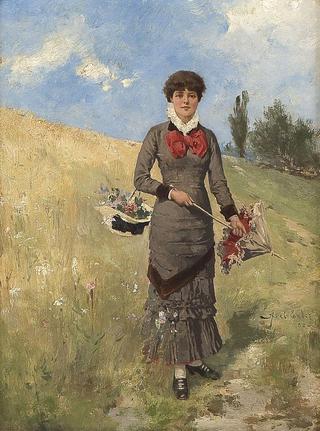 Young woman in the field of flowers