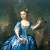 一个穿着蓝色连衣裙的女孩和一只鹦鹉在一个富丽堂皇的花园里的画像