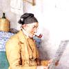 坐在瓦炉旁看书的农民